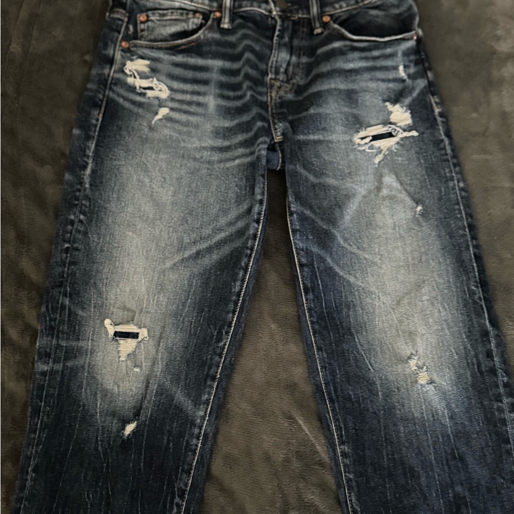 Young Men’s Distressed Blue Jeans